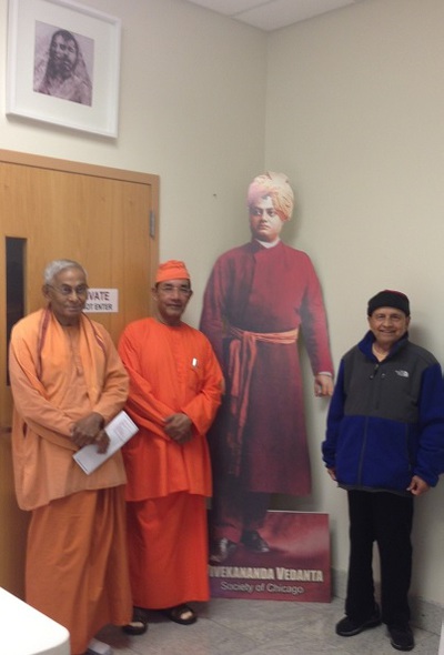 (L to R) Swamis Brahmarupanandaji, Ishatmanandaji, Chidanandaji with the cutout of Swamiji ID Parade Float with Swamis